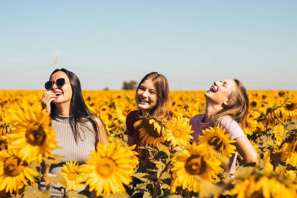 women in a sunflower field